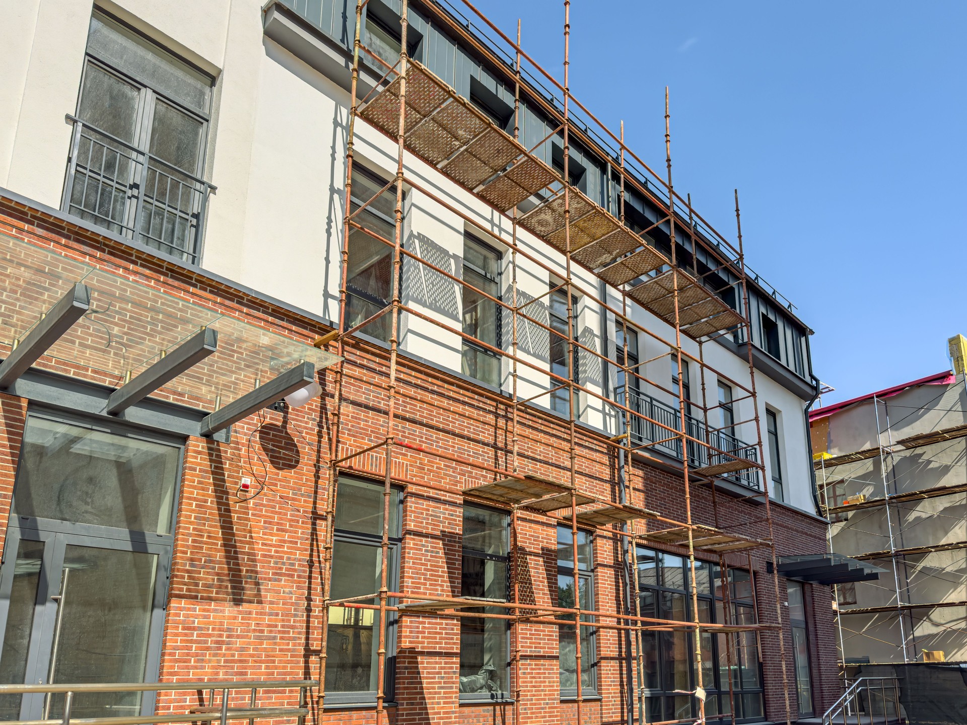 renovation of old building. facade with scaffolding. refurbishment works.